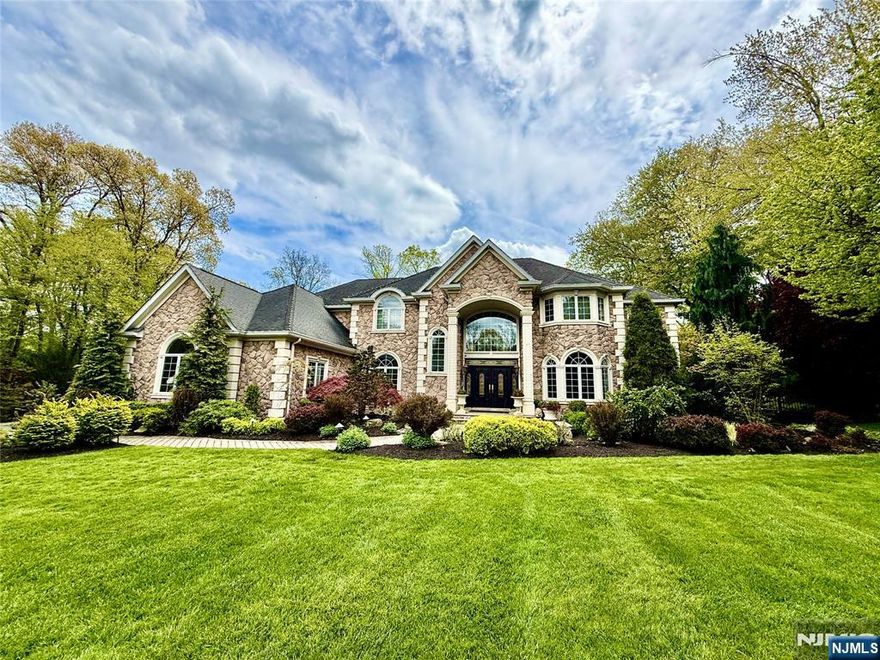 Set within one of Franklin Lakes most prestigious neighborhoods, this exquisite stone manor is a statement of timeless elegance and resort-style living. Sited on a great property it offers extraordinary outdoor entertaining space featuring pool with 5 waterfalls, spa and outdoor kitchen, capturing the culture and lifestyle of this distinguished residence. An inviting interior begins with a 2 story entry foyer, with sweeping curved staircase, custom Italian tile floor flowing into an impressive family room with extensive custom millwork, fireplace, corner wet bar and French doors opening to the patio and grounds beyond. The chefâ€™s kitchen is truly the heart of the home, offering a substantial center island, abundant custom cabinetry, and separate breakfast area enhanced by hand-painted murals. The main level also features a spacious formal dining room, elegant living room, laundry, office, and 1st floor bedroom with full bath. An additional first floor kitchen provides flexibility for entertaining, kosher use, or a thoughtfully designed first-floor in-law suite. Second level reveals a luxurious primary suite wing, complete with fireplace, sitting room, 2 walk-in closets, and spa-like bathroom. 3 additional en-suite bedrooms complete this level. An Entertainerâ€™s dream basement offers a recreation room, mahogany bar, 3rd kitchen, gym with sauna, bedroom 6, full bath, and storage. A truly exceptional home offering sophistication, scale, and unmatched lifestyle in Franklin Lak