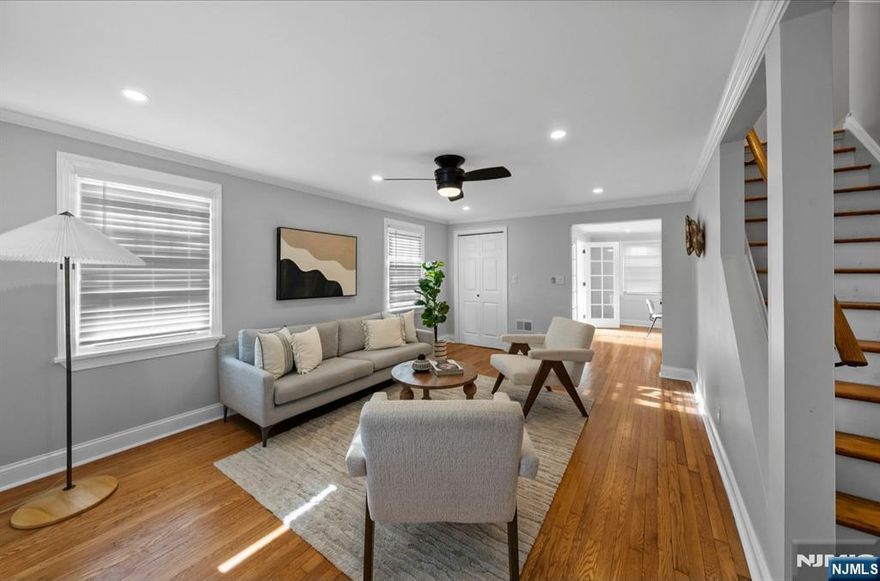 Welcome to this exceptionally spacious home set on a fully fenced 8,581 sq ft lot, offering privacy, versatility, and room to grow. With approximately 2,800 sq ft of living space, this residence features 7 generously sized bedrooms and a full bathroom on every level (3 total) ideal for multi-generational living, an in-law suite, or flexible work-from-home needs. The first floor offers a bright and inviting layout with hardwood floors throughout, a generously sized living room, a spacious dining area, and a large, convenient first-floor bedroom. The kitchen opens to a wrap-around deck via sliding glass doors, bringing in abundant natural light and creating a seamless indoor-outdoor flow perfect for entertaining or everyday living. Upstairs, youâ€™ll find four well-proportioned bedrooms, providing ample space for family, guests, or home offices. Finished basement further expands the homeâ€™s versatility and includes two additional bedrooms, a full bathroom, a kitchen, washer and dryer, and a private entryway ideal for extended family, guests, or supplemental living space. Outside, enjoy a detached 2-car garage, a large yard with plenty of space to run, play, or relax, and the peace of mind that comes with a fully fenced property. While there is no driveway in front of the home, convenient street parking is available. Ideally located within walking distance to parks both in front of and behind the home, as well as places of worship, schools, shopping, and public transportation.