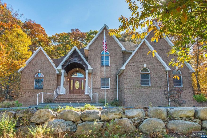 4300 SqFt Custom Home Located in Prestigious Stonehedge Estates. Located about 2 minutes from Route 23, Stonehedge Estates has long been considered a great find for luxury home buyers wanting a reasonable commute while being able to enjoy many recreational activities, including several of North Jersey's finest public golf courses. Located on 3.5 acres, this home includes 5 bedrooms, 5 full baths, office, sizeable kitchen overlooking the wooded yard. Movie enthusiasts will appreciate a large theatre with tiered seating on the home's main level. A 3 car garage & a massive rear deck spanning the width of the home make this a great home to enjoy summers as well as entertain guests. Included are 200 Amp electric service, a 16-kW standby generator as well as 32 panels of solar energy producing 8-9 kilowatts. In-ground sprinkler and well water are included to keep utility bills low.