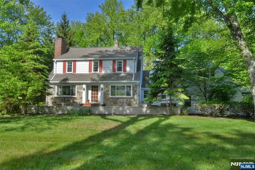 Welcome to this warm, inviting center hall Colonial situated on a wooded acre. Located perfectly for easy access to highly ranked schools, extensive shopping, public transportation and highways. Enjoy chilly winter evenings by the fire in the living room. Entertain family and friends in the sunlit dining room with room for all. The generously sized kitchen with stainless appliances and breakfast area is available for more casual dining. It overlooks the family room, which leads to both an enclosed sun porch (a few steps down) which overlooks the private, wooded property, as well as to the mudroom (potential office) with stairs to an unfinished attic. This addition was once a separate summer cottage and can now be renovated to accommodate extended family. Spring or summer evenings will be delightful while relaxing on either the front or back patios. The finished basement with wet bar and fireplace is ideal for game nights or gatherings of any kind. While the home currently has one full and two half baths, we received an estimate from a trusted contractor that it would cost approximately 7k to convert the large first floor powder room into a bath with shower. In addition, there is another large space on the ground floor that once housed a full bath. A non-working sink and toilet remain. Take advantage of Montvale's relatively low taxes and make this lovely home your own!