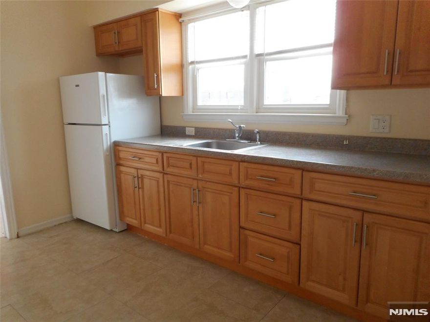 Elmwood Park, Bright sunny one bedroom apartment, kitchen with refrigerator & micro, living room, bedroom, bath ,hardwood floors, parking, one block to New York transportation, $1,550 plus utils, Coviello Realty, Listing agent Karen DePillis