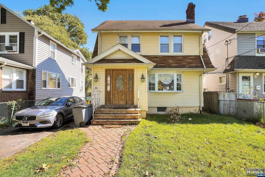 Updated two-family home with separate utilities. The first-floor unit features entry foyer, living room with wood burning fireplace, updated kitchen with quartz countertops and stainless-steel appliances. Two spacious bedrooms and a full bathroom complete the main level. The lower level features a recreational room, full bathroom, laundry hook up and two additional offices. The second-floor unit has a bright living room an updated kitchen with quartz counters and stainless appliances, 2 nice sized bedrooms, full bathroom and access to third floor bonus room. 2 Car detached garage. Close to NYC bus, shopping, parks and houses of worship.