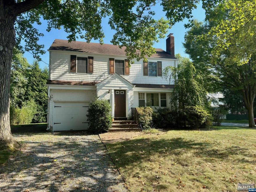 Nestled on a corner lot along a tree-lined street in River Edge, this 3-bedroom, 1.5-bath Colonial home offers the ideal balance of tranquility and convenience. Wood floors grace the interior, leading you from the inviting living room with a brick fireplace to the spacious dining room and kitchen. A sunlit den with sliding glass doors to the deck, and a convenient half bathroom complete the main level. Upstairs, discover three generously sized bedrooms and a full hall bathroom. With its ideal location near parks and NYC transportation, this home offers the perfect blend of classic charm and comfort. Don't miss out!