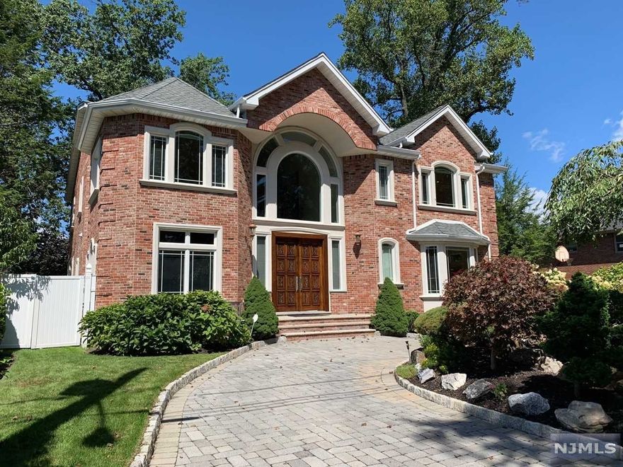 Splendid home full of every luxury in every step and moulding throughout the house. Gourmet chefs kitchen with top of the line appliances, wet bar in living room, dual walk in closets in primary bedroom suite with juliette balcony and spa-bath,3 en-suite bedrooms on 2nd floor,media room + rec room in lower level, with additional bedroom/full bathroom.3 car garage, come see for yourself.