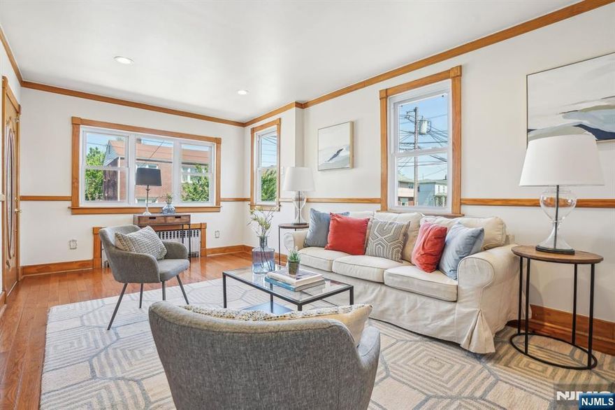 Cozy & bright Ranch style home - Ideal for first-time buyers or Downsizers. Meticulously maintained, this light- filled and full of charm offers the perfect blend of comfort and functionality. Featuring, Living-Dining combo, Large eat-in kitchen, 2 bedrooms, with full bath shower, office/playroom off kitchen, hardwood floors. The home showcases beautiful custom woodwork details and elegant French Doors that bring warmth to every room, freshly painted interior. Enjoy the one floor living with thoughtfully designed layout. The lower level includes Guest/Rec Rm, Gaming/Yoga/Gym a multitude of options, Full bath, Large laundry room and lots of storage rooms. The home has an amazing deep backyard that offers endless opportunities for outdoor enjoyment, gardening (vegetables & flowers) and entertaining. Great starter home or someone looking to downsize with style, this home delivers comfort, charm and practical living in every corner. Minutes away from NYC train line, shops restaurants. Move in ready, Home Sweet Home!