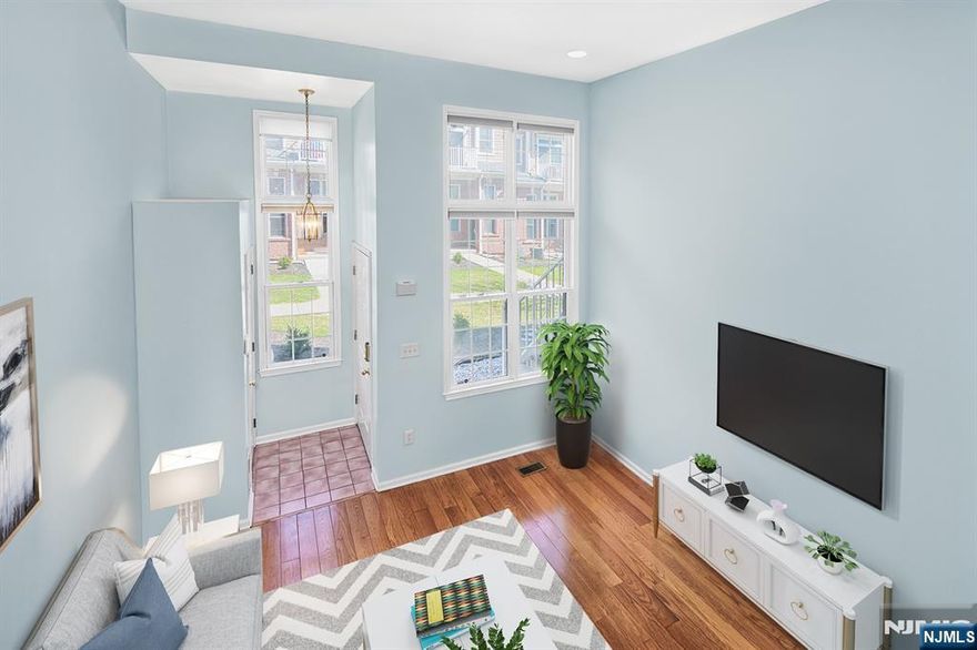 Popular Albany style home in sought after Jacobs/Bulls Ferry community. Two bedrooms, two bathrooms, with bonus rec room downstairs, could be used as third bedroom. Living room with soaring ceiling complimented with large windows. Dining area overlooking living room adds to the excitement of this property. Opposite to the dining area is galley kitchen with oak cabinetry and Corian counters. Master bedroom boasts bathroom en suite and a balcony. Parking for two cars; one in private garage and one in driveway, Community features two pools with jacuzzis, children's playground, waterfront promenade, and free shuttle to NY Waterway Ferry and Light Rail. Steps to bus to NYC. Close to restaurants and shopping. Do not miss this opportunity!!