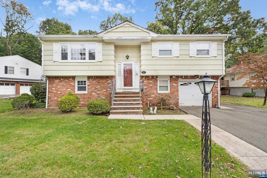 Located in a desirable neighborhood in North Haledon this 3 bed 1.5 bath home will not last long! The top floor of this bi-level offers 3 bedrooms and the main bath. The kitchen has updated countertops and a open concept looking into the dining room. Hardwood flooring is under all the carpets on this level. Downstairs you have a wood burning fireplace and a walk out slider that takes you to your paver patio in the backyard. Also located downstairs is a office/bonus room that could be turned into a 4th bedroom if desired. Location is key for this property which is located only a short distance to local shopping, restaurants and more. Commuting to the city? The train station is a quick drive to take you into NYC. Come see this home for yourself and make it into your own!