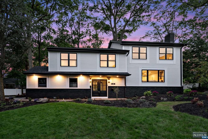 Fabulous RENOVATION in ultra-desirable Oradell. This stunning split level home has been beautifully transformed and now features 4 bedrooms and 4 full bathrooms with truly impeccable finishes. Beautiful glass railings greet you immediately in the entrance foyer giving you views of multiple levels of the home. Spacious foyer leads to private home office or bonus room. Finished basement with bar and wood burning FP. Head upstairs to the open-concept main level with LR, DR, and dream kitchen with breakfast bar, honed countertops, and SS Thermador appliances. Primary suite is so spacious with spa-like en-suite bathroom. Additional bedrooms are a great size. Large backyard with koi pond & deck, 2 car garage, and gorgeous landscaping. You will fall in love with this beautiful home. Oradell is home to an amazing school system, easy commute to NYC and wonderful community.