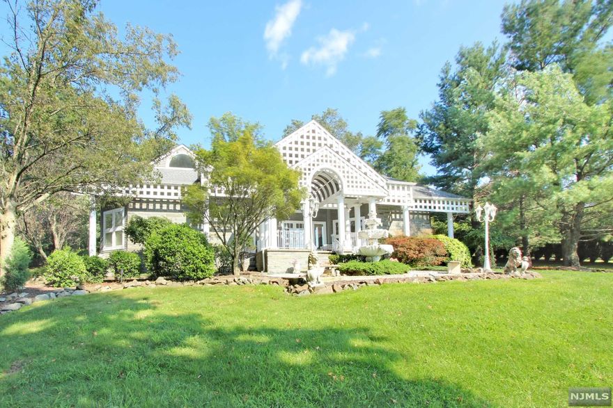 With Location And Privacy, This Custom-Built Contemporary, On Just Under 2 Acres Of Well-Manicured Property, Offers The Grand Open Floor Plan You Have Been Looking For! Over 20' High Vaulted Ceilings! Impressive Curb Appeal W Massive Front Yard, Flanked By Two Lion Sculptures & Stone Fountain, This Home Offers Over 5,500 SF Of Living Space & Approx. 2,900 SF Finished Basement! Features Include Grand Entrance, FIRST FLR. Full Master Suite, Luxury Lounge W Wet Bar, Formal Living Rm W Double Faced WB Fireplace, Sunken Dining Rm, Huge Kitchen W Double Ovens, 6 Burner Cooktop, Subzero Frig, Granite CC, Large Island & Sep Dining Area W Sliders To Deck & POOL. Sunken FR, 2 Half Baths on 1st, 9 Skylights, 3 Bedrms on 2nd Level & 2 Full Baths. Basement Incs. 2 Rec Rms, Full Gym, Sauna & Full Bath. Home Sold AS IS.