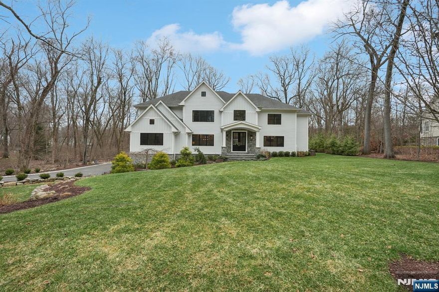 Exquisite Modern Farmhouse Colonial showcasing exceptional craftsmanship, custom millwork and beautiful details throughout. Step into a home where elegance meets inspiration. This five year old, custom built house offers a very comfortable floor plan, perfect for entertainment and everyday life. A dramatic two-story entry foyer sets the tone for the home's refined elegance. Gracious entertaining areas include grand-scale dining room with fireplace, private office with vaulted ceiling, while expansive windows fill the home with natural light and overlook beautiful grounds. The chef's kitchen is the heart of the home with oversized island, top-of-the-line appliances, and abundant workspace. The kitchen flows seamlessly into the family room highlighted by a cozy fireplace. The luxurious primary suite serves as a true retreat, featuring a spa-inspired bath designed with finest finishes for ultimate comfort & relaxation. Finished lower level is complete with game rm, built-in wet bar, gym and full bathroom. Recently completed outdoor oasis including a custom kitchen with high-end appliances, pizza oven, and gas fire pit. This stunning mini estate features elegant Hardie plank and stone exterior creating timeless curb appeal.