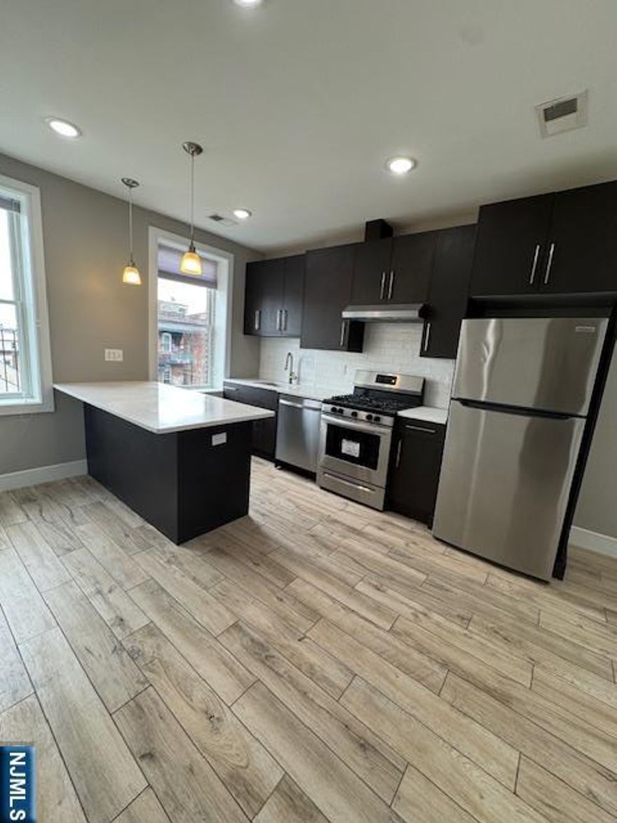This beautifully renovated one-bedroom apartment in the vibrant Ironbound neighborhood of Newark offers modern living with brand-new appliances. Located within walking distance to Newark Penn Station, shopping, and restaurants, it's perfect for those who want convenience and style. The building features a coin-operated laundromat in the basement, with additional storage available for an extra fee. Don't miss the chance to make this stunning, newly renovated apartment your next home!