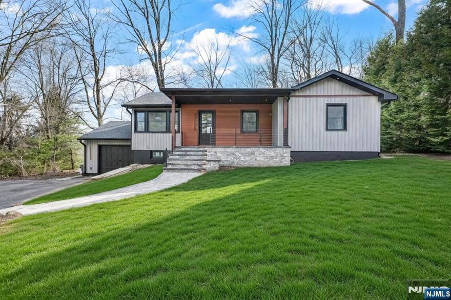 Completely renovated from top to bottom, this move in ready home is located in West Milford, just 2 blocks from High Crest Lake,.The house was redone inside and out. Updates include new hardwood floors, walls, windows, siding, gutters, roof, kitchen, bathrooms and more. Before Closing the home will have brand new central air. The heating system is oil (above ground) located in the garage.The main floor has 3 bedrooms and 1 full bathroom, which includes both a shower and a tub. The primary bedroom has 2 closets. The kitchen and living room are open concept and include an electric fireplace, along with completely new appliances, and towel warmers. The finished basement adds extra space and includes 2 additional rooms, 1 full bathroom, a laundry area with hookups, a mechanical room, and a separate entrance from the back, transform the basement into endless possibilities. It also has direct access to the garage. The septic system was serviced in December 2025. Long driveway offering plenty of parking. A great opportunity to own a fully renovated home in a quiet area near the lake. Wood burning fireplace in the basement. Septic recently serviced in December 2025, not knowing issues, as-is. New owners have the option to become members of the lake community and have access to all the lake activities if desired.