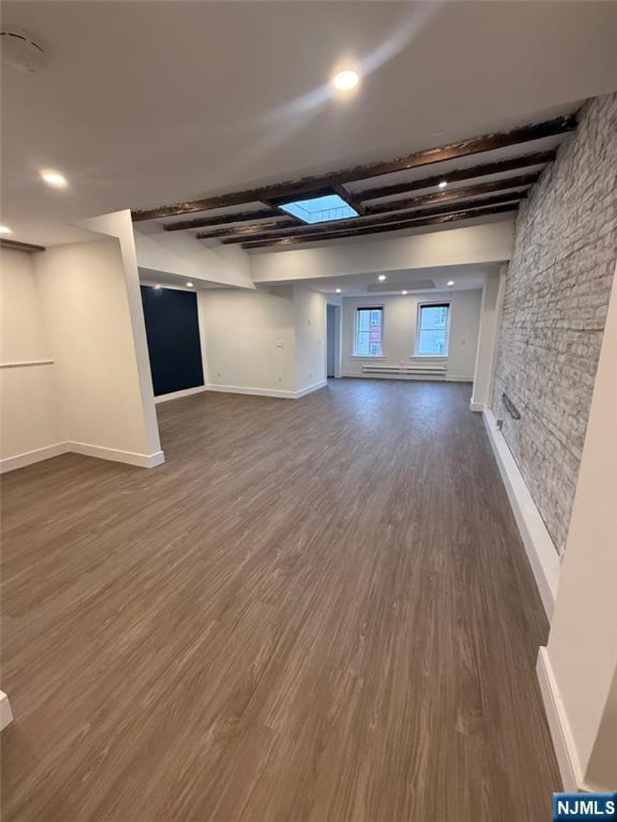 This newly renovated office space in the heart of Downtown Ridgewood was thoughtfully designed to retain its original charm while meeting modern needs. Approximately 750 square feet, this office space is large and open with a semi-private office and private bath. Perfect for a design studio, or general office space. Featuring lots of natural sunlight from its southern exposure, original wood beams, skylights, original brick wall, new recessed lighting and new central AC. Located at the top of E. Ridgewood Avenue near Broad Street and the parking deck which provides plenty of extra parking.