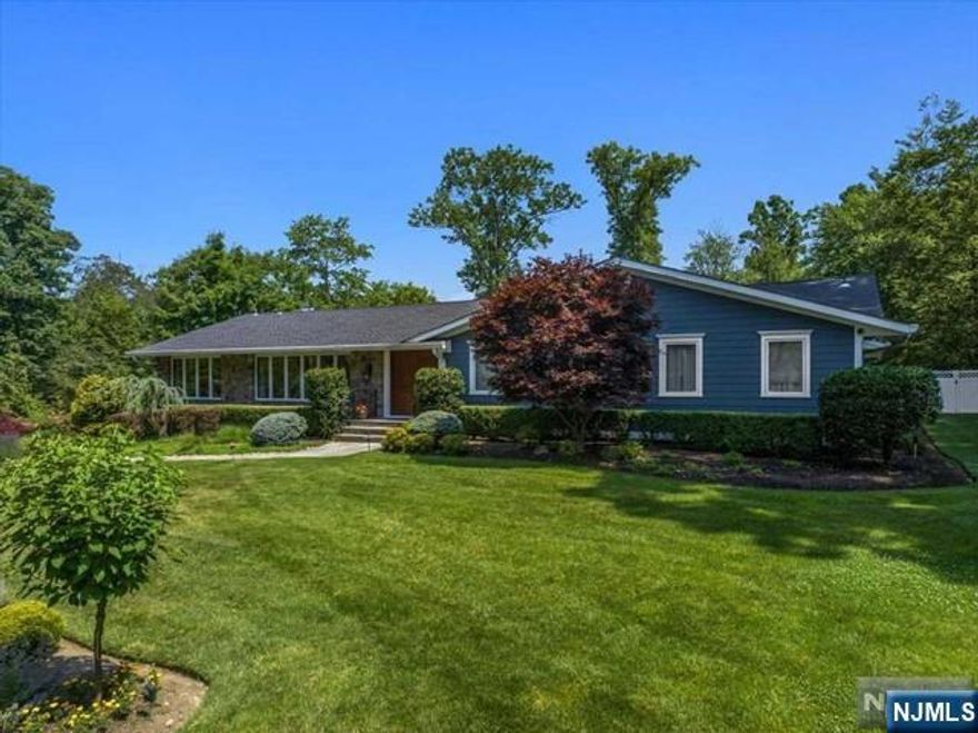 Welcome to your ultimate sanctuary in Upper Saddle River, where luxury living blends with an exclusive lifestyle. This 4-bedroom, 4.5-bath ranch home embodies sophistication & comfort. Start your day in a lavish primary suite overlooking a custom pool with a cascading waterfall & enjoy an expansive outdoor living space perfect for entertaining. The backyard is an entertainer's dream, featuring an amazing deck ideal for summer gatherings and lasting memories. The home also features an additional en suite bedroom, offering guests or family their own private haven. The chef's kitchen is nothing less than magnificent with stainless steel appliances, a large granite island and endless cabinet space. Follow the open concept to a stone faced fire place in the den or into the oversized dining area. The finished basement is complete with a game room and office. The home is completed with a 4 car garage space & a full home generator. 1 of a few homes to have public sewer in USR. NO SEPTIC!