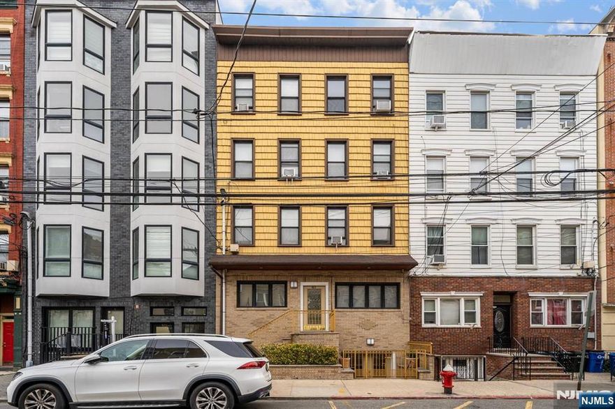 Exceptional investment opportunity! This legal 4-family property offers incredible versatility, income potential, and future upside. In addition to four well-laid-out residential units, the home features a beautifully finished full basement--perfect for owner occupied, extended living or added functionality. The ground level boasts a spacious primary bedroom with a private bath, a modern eat-in kitchen with stainless steel appliances, formal dining room, comfortable living room, dedicated laundry room and direct access to a beautifully maintained yard - ideal for entertaining. Additional highlights of this unit include ceramic tile flooring throughout, central air and a ventilation system for the cooking enthusiast or a smoker. Each of the four apartments offers a functional layout with two bedrooms, a full bath, and a combined living and dining area alongside a full kitchen. Generous room sizes and flexible floor plans provide excellent potential to reconfigure into three or even four bedroom units, or to incorporate a formal dining room to further enhance value. Whether you're an investor looking to maximize rental income or a buyer seeking a property with expansion potential, this is a rare opportunity to own a multi-family home with both immediate appeal and long-term growth potential.