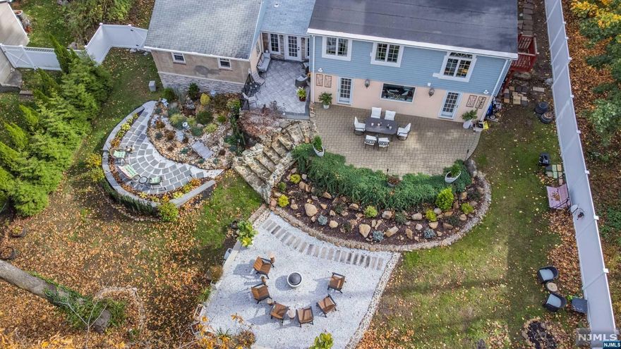 You will be incredibly surprised! Amazing upgrades, entertainment paradise property and wonderful custom layout all located in desirable Packanack Lake Community. Charming living room with fireplace, open floor plan with updated kitchen: breakfast bar center island, custom glass cabinets and granite counter tops. Large dining room/breakfast room with beautiful custom windows adjoining to family room with great closets and lots of natural light. Owners suite sanctuary: dream walk in closet room, newer high style bathroom and nice size bedroom. Second floor: 2 large bedrooms with newer bathroom. Wonderful walk out lower level: 2 huge recreational rooms with gas fireplace, large windows, powder room, Zen den, storage and 2 car garage. Enjoy the outdoors: impressive multi level patio with plenty of room for parties or quiet fire pit night at home. Hardwood floors, fenced in yard, wonderful floor plan based on needs, tons of storage and newer windows. Great location.