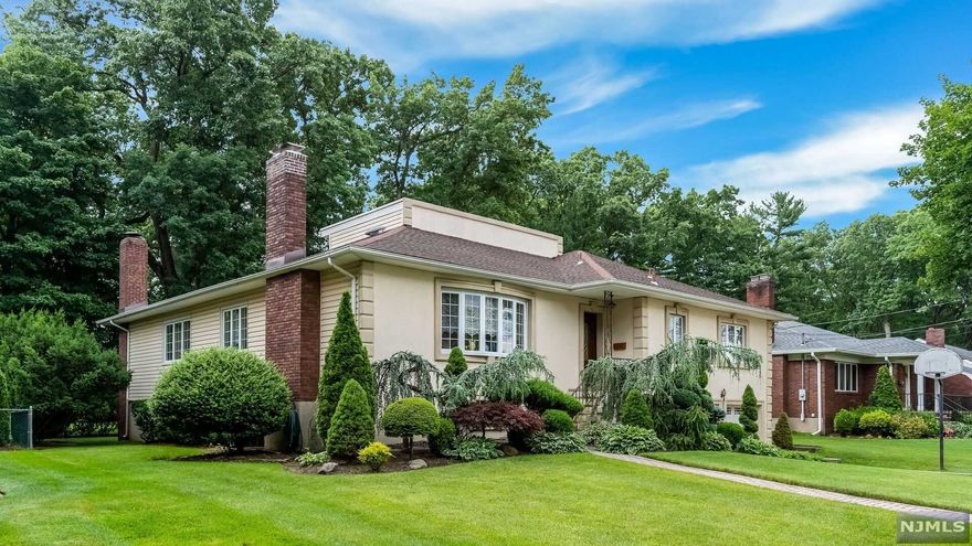 Welcome to this meticulous 3 bedroom ranch home that is located on the most desirable street. Manicured landscaping greats you upon arrival. You walk into a large entry foyer with a coat closet. Then you walk into the formal living room that offer a large window that lets in plenty of light and a gas fireplace w/ beautiful mantel, the large formal dining room is located just of the LR, French doors lead you into the cozy family room with ts wall of exposed brick and fireplace, built in bar, and windows that allow you to enjoy the private backyard. The updated kitchen has custom wood cabinets, stainless steel appliances, granite counters and sliders that lead to a oversized deck. Full bath w/ tub and shower stall, bedroom with double closets. The primary bedroom has walk-in closet and full bath with a steam shower. The second level finished with full bath and large bedroom and plenty of storage. The lower area has been finished for entertainment and laundry rm. and 2 car garage.