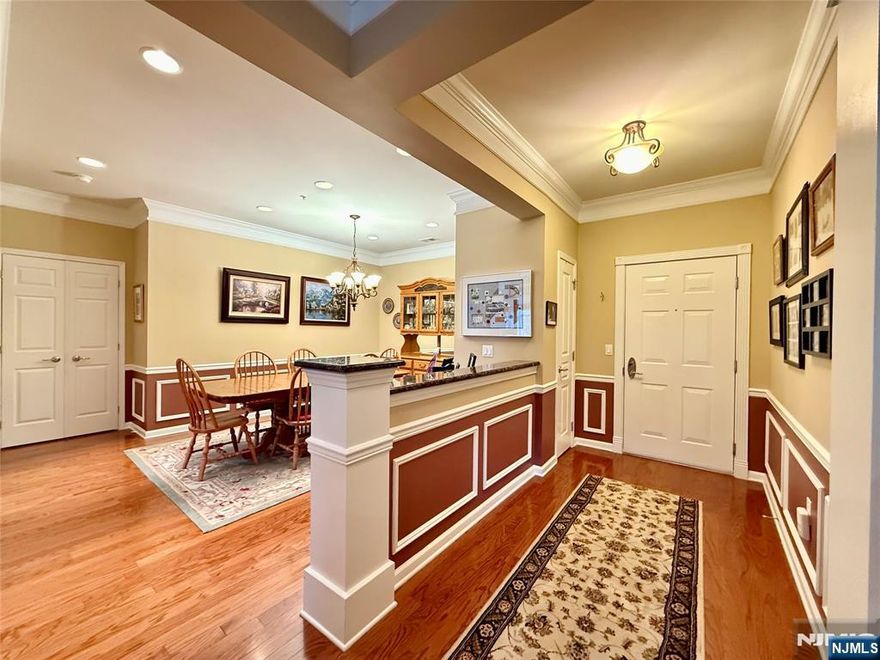 INT PICS COMING SOON! Very Rare! Gorgeous 2 Bedroom, 2 bath RYERSON MODEL (1910 sf), 3rd floor condo in a beautiful 55+ gated community with 24 hour security. The primary bedroom suite includes a large sitting area, primary bath & plenty of closet space. Featuring a spacious eat in kitchen with beautiful granite counters, backsplash, all SS appliances & pantry. Large formal Living Rm with sliders to a spacious balcony with beautiful, private wooded views. Formal dining room with plenty of room for holiday dinners. Spacious den with beautiful French doors. Spacious laundry room. One assigned parking space in the garage, underneath building with additional parking outside. Amenities include beautiful crown moldings, tray ceilings, chair rail, architectural trim work throughout and stunning pillars as you enter through the foyer. Clubhouse with Cafe features activity director with over 40 clubs to join. There is so much to do here with a lifestyle community sure to meet your social, recreational and fitness needs! Amenities include indoor and outdoor pools, theatre, live shows, exercise room, saunas, hot tub, art studio, ballroom, billiard room, tennis courts, bocce & shuffleboard and so much more. In addition to all the amazing amenities, HOA also includes water/sewer, cable & internet.