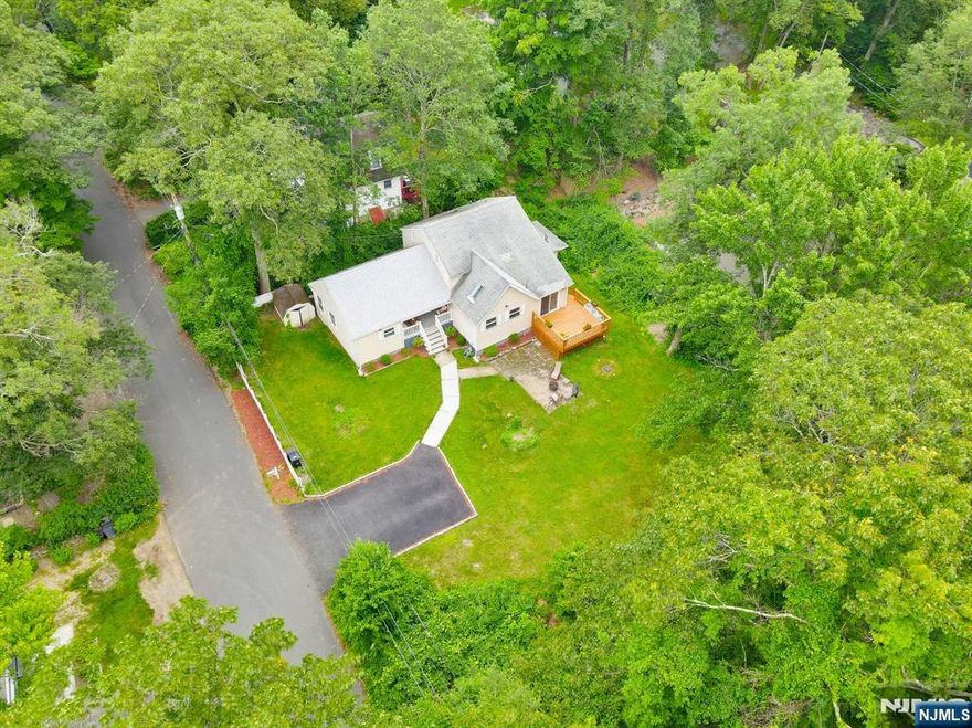 Welcome To This Custom Expanded Ranch! Offering 3 Bedrooms And 3 Full Baths! This Home Stands Out With It's Airy, Flowing Layout Designed For Comfortable Living! Step Onto The Inviting Open Porch & Into A Generous Foyer, Leading You Into A Bright Eat-In Kitchen, Featuring A Cathedral Ceiling, Granite Countertops, Ample Cabinetry, And A Storage Pantry Closet! Just Off The Extended Foyer Is A Formal Dining Room And Then It Connects You To The Living Room, Where A Large Window Fills The Space With Afternoon Light! An Optional First-Floor Primary Suite Offers A Full Bath And Storage Closet With Pop-Up Attic Access! A Dedicated Office/Bedroom With Sliders Leads To Its Own Private Deck & Stairs To The Level Yard! Work From Home With A View! The 1st Floor Includes A 2nd Full Bath With Tub/Shower And An Oversized Laundry Room With Tankless Navien Water Heater For Energy Efficiency! Retreat Up To Your Impressive 21'x25' Primary Suite W/Beautiful Hardwood Floors (Installed 2022), A Walk-In Closet, & Private Bath With Stall Shower! Situated On A Level Lot With A Partially Fenced Yard, Patio And Shed! Recent Updates Incl. New Porch, Front-Facing Roof With Ice Shield, Upgraded Well Cover, Brand-New Gutters W/Aluminum Leaf Guards In 2024! Move-In Ready And This Unique Home Is Unlike Any Other! Home Also Equipped W/Portable Generator! Conveniently Located Near Ski Resorts, Warwick NY Shopping, Restaurants, Wineries, Apple Picking, A Drive-In Theatre, Hiking, Bike Trails, And More!