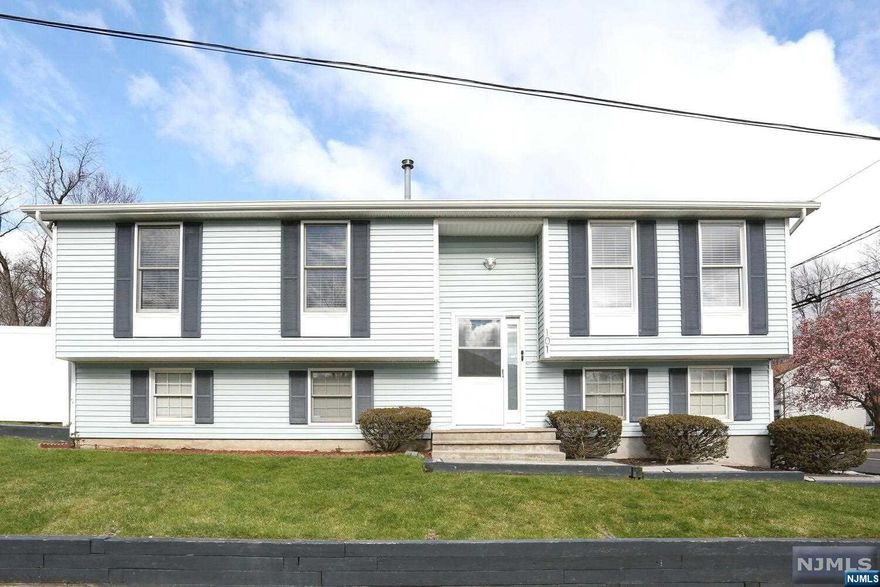 Beautiful move-in ready 4 bedroom, 3 full bath home! Bright and open floor plan with gleaming hardwood floors. Large living room, modern kitchen with island open to dining area with sliding doors to spacious yard. Large master suite including full bath and large closet. Two additional generous-sized bedrooms and updated full bath. Fully finished lower level including expansive family room with laundry area, spacious bedroom, 3rd full bath and convenient access to garage. Lovely fenced-in yard with patio - great for entertaining. Close to shopping, restaurants, schools and NYC transportation! You will absolutely love living here! newer gas heat and dishwasher