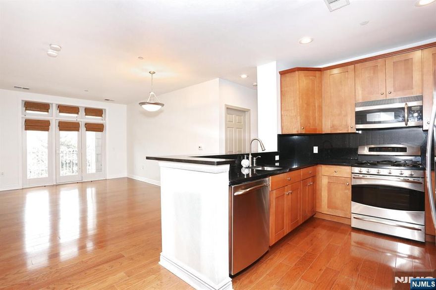 Come see this well maintanted waterfront condo. This 2 bedroom two bath unit has a lot to offer. Hardwood flooring throughout, beautiful tiled bathrooms, primary with walk-in closet, granite countertops, stainless appliances, washer/dryer in unit and a balcony. One assigned parking space conveniently located in the garage near the unit entrance and one floating space provided. Fitness center, common room, pool and courtyard complete the package. Close to NY transportation. Come view it today!