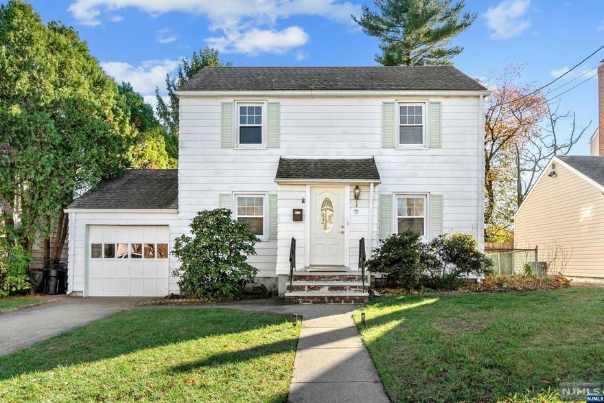 Spacious Lovely Colonial. Featuring 3 bedrooms 1.5 Baths. Newer Central Air and Roof. Oversized 3 season room overlooking backyard. Living room, formal dining room, attached garage and partially finished basement. Close to all major highways and NYC transportation. A Must see!