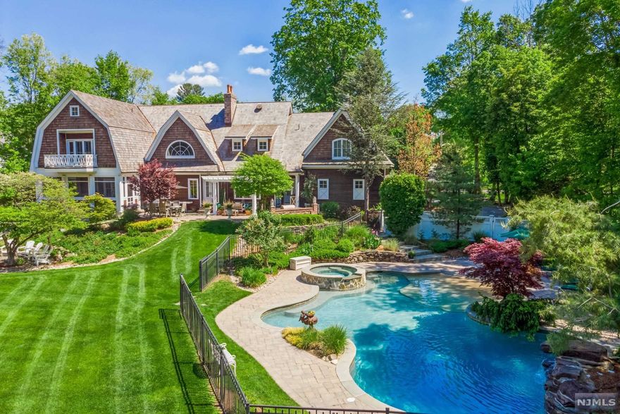 Welcome to this extraordinary Wyckoff home which has been admired from afar by many. A stunning Hampton Style 1.6ac estate crowned w/a new cedar shake roof,abundant windows, stone walk-ways, exquisitely crafted porches & thoughtful landscaping.The tar & chip driveway leads you to a park-like backyard hosting a vintage red barn, Masterson beach-entry Gunite pool & stone patio fitted for outdoor entertaining.Upon entering into the home's 13rm interior you are immediately wowed.The GRT rm stuns w/except'l mill work, vaulted ceiling, wide plank oak flrs throughout & grand stone firepl. that separate a billiards rm on the other side.MEIK seamlessly unfolds in the open floor plan. Forino Cabinetry, top of the line appl's, new quartz counter tops.Upstairs, MBR suite w/balcony has ample closet space & an elegant spa-like MBath complete w/steam shower & soaking tub. 3bdrms & en-law suite w/separate staircase & gym.Bsmnt w/bar rm, Fam/Rm & turfed area.1 listing agent is related to sellers.