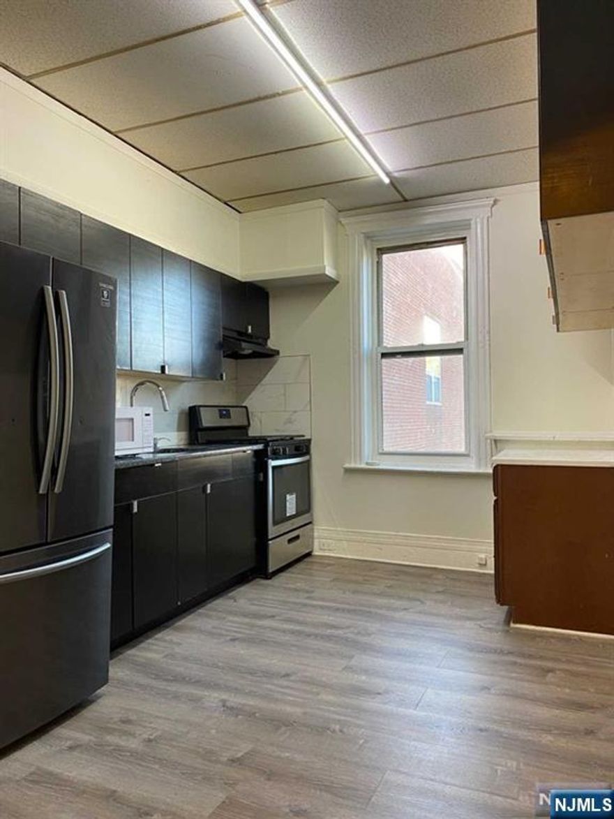 Top floor apartment located in the heart of Englewood!!! Is now ready for new Tenant. Spacious 3 bedroom apartment in the center of downtown Englewood! Steps away from public transportation to NYC, restaurants, shops and Wow nightlife. This features an updated eat-in kitchen, nicely updated bathroom, hardwood flooring throughout, high ceilings and large windows to allow plenty of light. The apartment includes a den off the master bedroom perfect for a office, nursery or large walk-in closet! The tenant is responsible for all utilities.Tenant insurance required. Np pets.