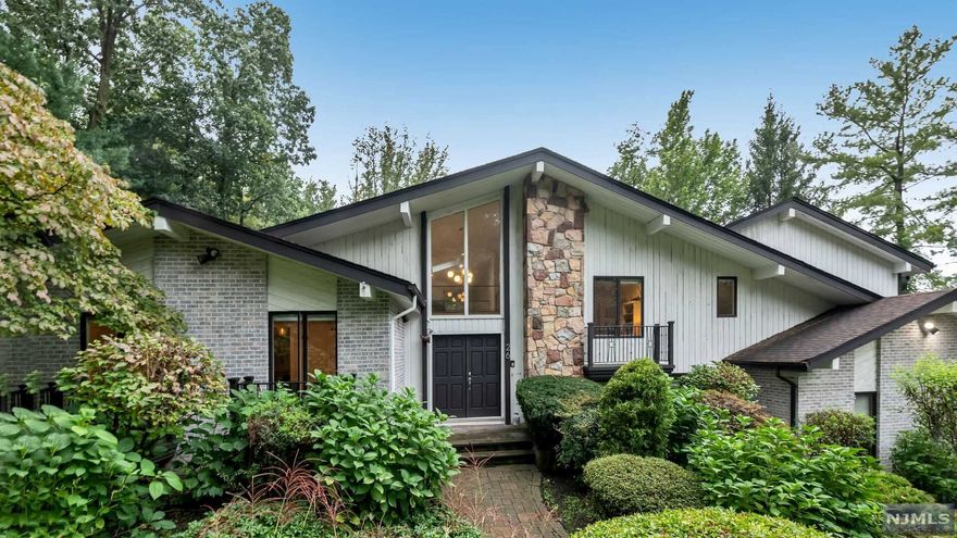 Welcome to this 7 bedroom, 4 full and 1 half bath contemporary situated on approximately one acre of lush landscaped property on the sought after East Hill of Cresskill. Enter through the 2-story foyer to find a great room with floor-to-ceiling windows overlooking the incredible backyard, formal living and dining rooms, as well as an eat-in kitchen with center island and stainless steel appliances. Completing the main level is the master bedroom suite with luxurious master bath and walk-in closet, 3 additional bedrooms and a full bathroom. The lower level is perfect for entertaining with 2 additional bedrooms, 2 full baths, gym, media room, game room, billiard room and wet bar. Second floor has a loft-style family room overlooking the great room and foyer. The private backyard with several terraces/decks features an in-ground pool, fire pit and two outdoor covered seating areas perfect for relaxation. This home is truly a must see!