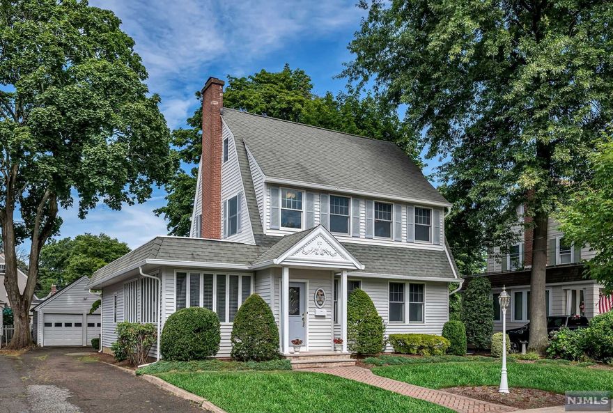 Welcome to this updated and expanded Dutch Colonial in sought-after Ridgewood. Located on a recently repaved tree lined cul-de-sac street, the flexible floor plan is ideal for extended family living. This charming colonial home first floor features a living room with a gas fireplace, formal dining room and a beautiful updated kitchen, all with 9 ft. ceilings. Walls of windows sunroom/den and a powder room. The skylit family room extension is also ideal for a first-floor primary suite with a rear entry and ramp access, a full bath and laundry complete the first floor. The second level offers 3 bedrooms and a newly updated full bath. The 3rd level offers a bedroom/office and attic ideal to finish for even more usable space! Many other features include the Anderson windows, detailed moldings, central a/c, u/g sprinklers. 2 car detached garage with storage, private rear yard embraced by shrubbery and tall trees. One year AHS home warranty included. Come make this your Home Sweet Home