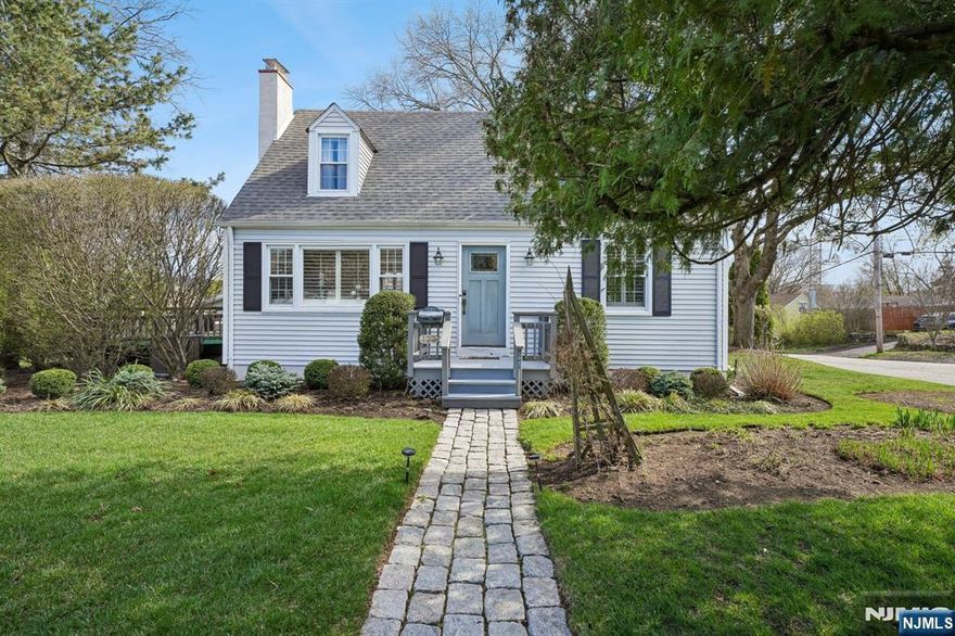 This is the kind of home that just feels right the moment you arrive. Set on an oversized property with beautiful curb appeal, it offers a classic center hall colonial layout with a fresh, inviting feel throughout. Step inside & the living room immediately stands out. It is spacious, filled with natural light & anchored by a wood-burning fireplace that brings warmth & character. Itâ€™s easy to picture everything here, from quiet nights to a full house of guests. Just beyond, an oversized deck extends your living space outdoors, perfect for entertaining, relaxing, or enjoying the yard. The dining room is bright & welcoming, flowing naturally into the kitchen, creating a layout that feels effortless for both everyday living & hosting. A convenient half bath completes the main level. Upstairs, you will find three comfortable bedrooms & a full bath. The finished basement adds even more versatility, with a cozy family room, full bath, kitchenette & laundry, ideal for guests, extended living, or a flex space. One-car attached garage plus an oversized two-car detached garage, a rare & valuable feature, perfect for a contractor, hobbyist, or anyone needing extra storage or workspace. Newer roof, newer HVAC & hot water heater. Truly a move-right-in home. All of this in Mahwah, surrounded by natural beauty with nearby parks, hiking & mountain views, easy access to major highways & NYC transportation & low taxes that continues to make it one of the most appealing towns in Bergen County.