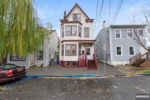 Photo of 21 Olive Street, Paterson, NJ 07501 (MLS # 25042604)