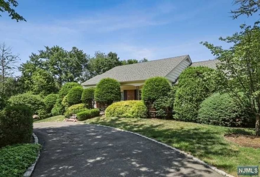 Fabulous opportunity to live on one of North Caldwells most prestigious streets! Close to an acre of beautiful private property! Inground pool! 5/6 Bedrooms! Bring your decorating ideas to make this home your own! This sale is strictly "AS-IS"