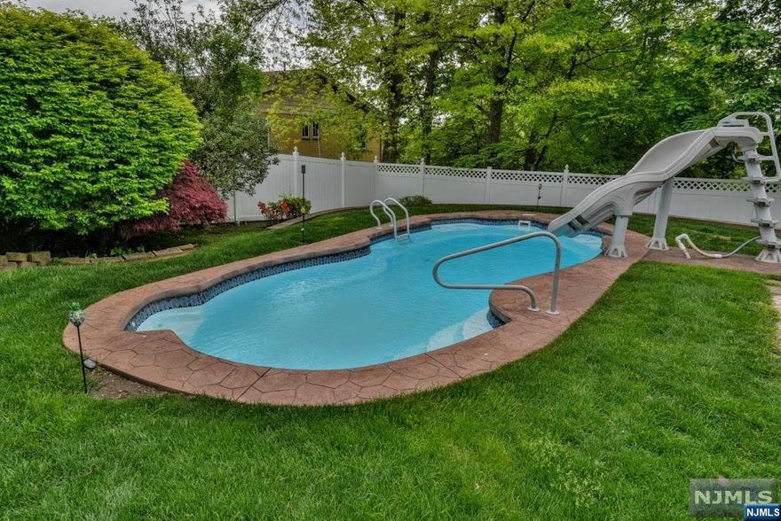 Welcome to 8 Upland Way in beautiful Cedar Grove. You will never want to leave this beautiful oasis on a nice quiet residential street. You'll find updated full bathrooms on the first and second floors! 1st floor features living room with wood burning fireplace, MEIK with granite countertops, FB with a jetted bathtub, laundry room/pantry, dining area, and a great room! The 2nd floor consists of one BR and a FB. Step out the sliding glass door from the great room and enjoy the private back yard. The NO MAINTANCE composite, deck is great for entertaining. There is also a retractable awning that covers the entire deck area, which oversees the heated IN-GROUND SALT WATER pool with a slide. Step off the deck and to your left is a hot tub just waiting for those winter nights and or to just relax after a hard day. There is a one car attached garage, large shed, one zone AC, two zone heating.This home can't be missed. Home sold as is.