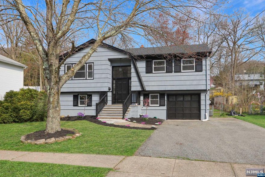 Discover unparalleled comfort in this newly renovated Raised Ranch in a picturesque and serene neighborhood in Bloomingdale. Entertain guests or unwind after a long day in the grand living room flooded with natural light. The gourmet chef's kitchen is a culinary enthusiast's dream, complete with top-of-the-line appliances and elegant finishes. A delightful and spacious dining room opens to both the kitchen and living room offering a perfect mix of space for relaxation and rejuvenation with its open floorplan. Explore four newly renovated, generously sized bedrooms offering comfort and style. Each room features ample space for relaxation and storage, with modern finishes and an inviting ambiance. The one-and-a-half bathrooms boast contemporary design and luxury amenities, including sleek fixtures and elegant tilework, providing a spa-like retreat for you or your guests. Amazing sunlit family room adorned with double doors that open to a picturesque patio and sprawling backyard.