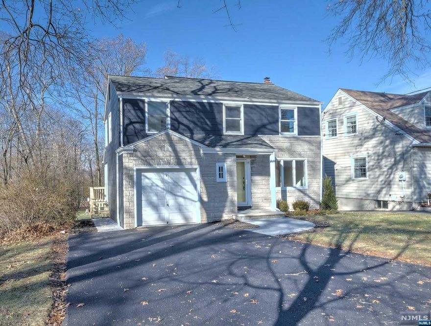 Let the sun shine and set on this Enchanting 3 Br colonial situated on almost a quarter of an acre. Oodles of opportunities to expand, install an in ground pool, or create a dream oasis! Watch the sunset on the rear covered porch overlooking the gardens and greenhouse! Newer Roof, New Driveway, WIndows, Central Air and electric panel. Refinished hardwood floors throughout! Attached oversized 1 car garage and partially finished basement! Bring your palette and design your space! Ring in the new year in the heart of Laning section! Close to park,schools NY trans shopping and dining!