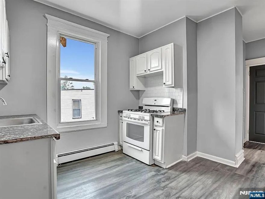 Sun-drenched, updated 2 bedroom, 1 bath apartment on the 2nd floor of a well maintained duplex. This move-in ready unit features an updated kitchen and bath, comfortable bedroom sizes, and plenty of natural light throughout. Heat and hot water included for exceptional value. Conveniently located near shopping, dining, major bus routes, University Hospital, and Rutgers University (10-15 minutes away), with easy access to Newark and NYC transportation. First month's rent and 1.5 month security deposit due at lease signing. No pets. A must see!