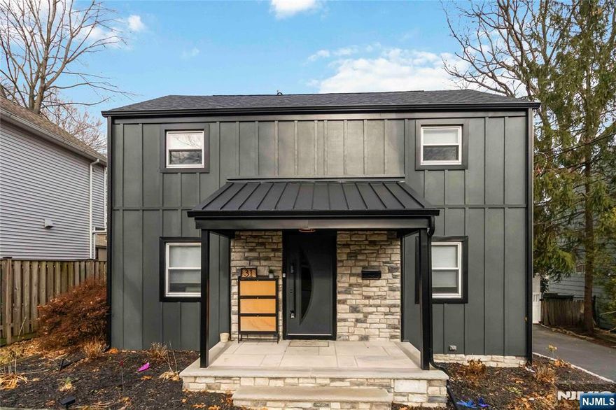 Enjoy modern living in this beautifully renovated 3 BR Colonial, ideally located on a quiet residential street near the Ridgewood/Glen Rock border. The home features a bright open layout with contemporary decor and refinished hardwood floors. The modern kitchen with double wall ovens will make cooking a pleasure, as you step into a bright, inviting sunroom, that can be enjoyed as additional entertaining space. Upstairs you will find a primary bedroom with a walk in closet, two additional comfortably sized bedrooms and a stylish, renovated full bath. The private, fully fenced backyard complete with a custom outdoor kitchen and dining area under a gazebo offers exceptional outdoor space for relaxing or entertaining. The basement has a washer and dryer and provides additional storage, and there is an oversized heated garage with expanded paved patio area and ample driveway parking. With close proximity to schools, parks, shopping, dining, major highways, and public transportation, this fully renovated home offers comfort, convenience, and modern style in a fantastic location.