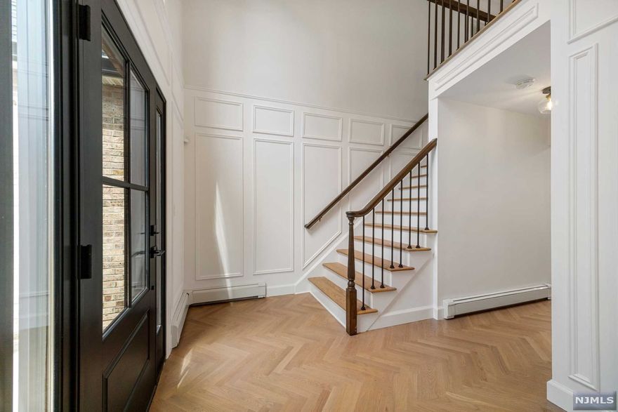 WOW! Jaw Dropping Custom Renovation and Thoughtful Design. Perched up on the East Hill. 4 bedrooms & 2 1/2 bathrooms with every detail imaginable. Incredible layout that is stunning yet warm, inviting & ideal for entertaining. A sunlight drenched double story entrance foyer welcomes you to beautiful herringbone pattern weathered white oak wood floors & custom trim work. Continue into the Designer Kitchen w. high end GE Cafe appliances and jaw dropping double thick 9 foot island w/ waterfall edge, Open-Concept to Fam. Room. Each Bathroom Features Large Slab PORCELANOSA Tiles with High End Finishes and Workmanship. Private Dining and Living Room/Office Space complete the main level. Primary features a one of a kind en-suite primary bath with waterfall shower & soaking tub. 3 more bedrooms, full bath, laundry complete the 2nd level. Lower Level boasts an approx. 900 sqft. Finished Basement outfitted with Den/Office. 2 car garage. Enjoy the Mountain Views All Day. Owner has NJ RE Lic.