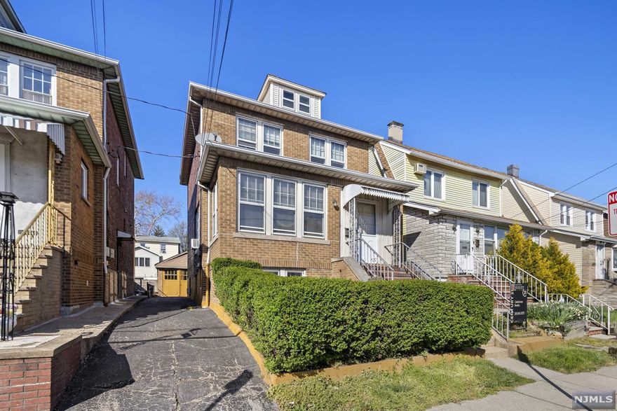 Extremely well built all brick Colonial home in Fairview's finest neighborhood. Bring your bright ideas and create your dream home. Charming home with good bones, original woodwork and hardwood floors throughout. Features gorgeous sun room with french doors leading to large living room, formal dining room and kitchen with pantry. Second floor features 3 bedrooms, full bath and den/office. 2 car detached oversized garage and partially finished basement with full bath and kitchenette. Convenient to shopping, schools and NYC transportation.