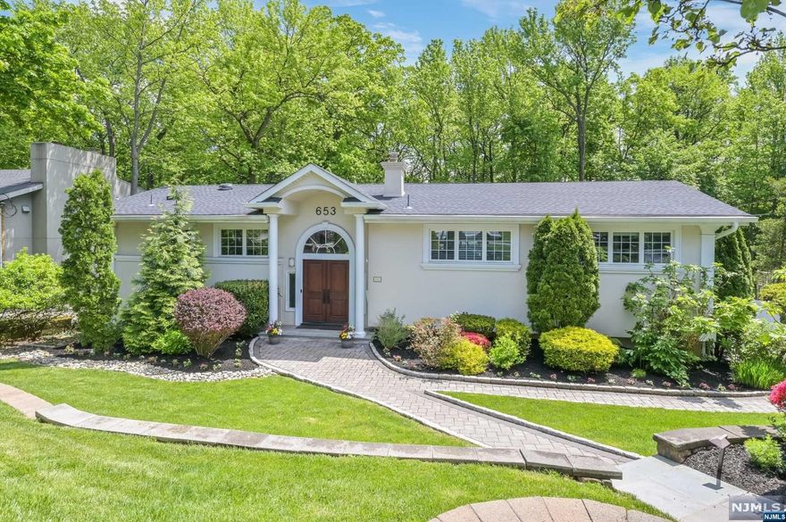 Rare opportunity to buy a recently remodeled contemporary home located in the coveted North Cliffs! You'll be impressed by this professionally designed home featuring large windows offering natural light throughout. The kitchen features quartz countertops and high-end stainless steel appliances. The living/dining rooms boast a vaulted ceiling with gorgeous views. The primary suite spotlights custom woodwork and a beautiful new bath. The property has two sets of stairs, offering convenience and functionality. The lower level features a bedroom, a new full bath, den, office, and a family room with sliders to the manicured, secluded, and fenced property with a large paver patio and a fire pit. New 2-car garage doors, roof, windows, floors, generator, high-quality Porcelanosa flooring, and tiles. All within a short walk to the North Cliffs School. If you are looking for an exceptionally maintained and updated home with low taxes that you can move right into, this is the one!