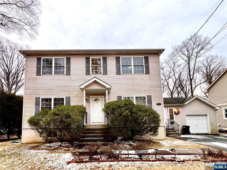 Welcome to this stunning four-bedroom, 3.5-bathroom Center Hall Colonial in a wonderful location. The first floor boasts a spacious open floor plan with gorgeous hardwood floors, a bright and airy living room, a beautifully designed kitchen with a center island, and a dining area with sliding doors leading to an oversized cedar deckâ€”perfect for entertaining. A bedroom, full bath, and a convenient mudroom connecting the living room to the garage complete this level. Upstairs, the master suite with a walk-in closet and full bath, two additional spacious bedrooms, and another full bath. The fully finished basement offers endless possibilities: a large recreation room, an office with a half bath, and a spacious laundry room. Enjoy breathtaking lake views from the deck overlooking the expansive backyard, creating a serene and picturesque retreat. Conveniently located near public transportation, shopping, recreational centers, and top-rated schools.