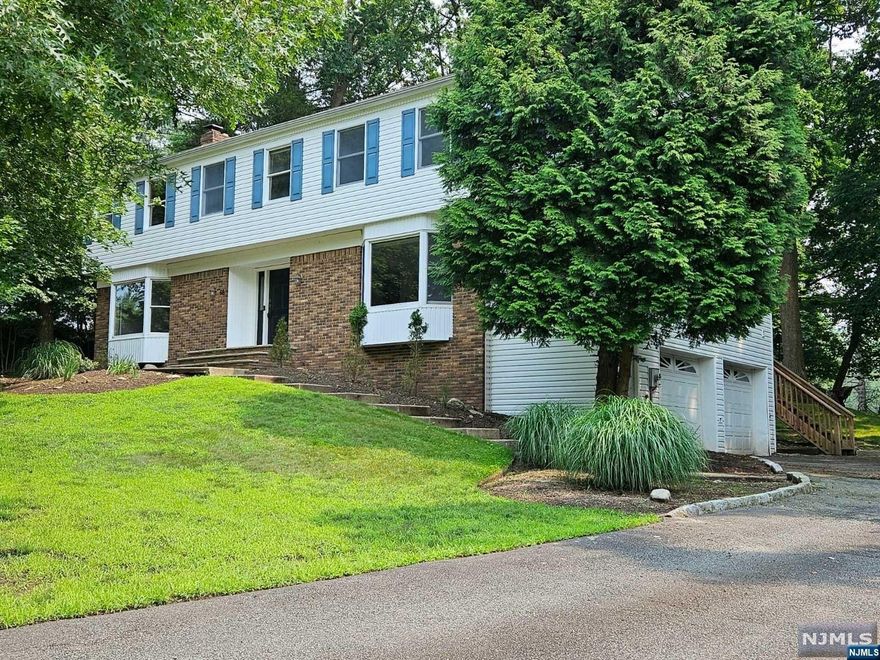 Please Call Wayne:201-452-4548 or Susan:201-370-2000. Welcome To This Freshly Painted Beautiful 5 Bedroom, 3 1/2 Bathroom Center Hall Colonial Located on A Cul-De-Sac on The East Hills of Closter. The Spacious 1st Floor has a Large Entry Foyer With 2 Coat Closets, Both The Modern Eat-In Kitchen & Living Room with Cathedral Ceilings Have Sliding Glass Doors Opening Onto A Large Deck, Formal Dining Room, Family Room with Wood Burning Fireplace, Bedroom, Full Bath, Laundry & Mudroom Complete The 1st. Floor. The Second Floor Features the Primary Bedroom with Full Bath, Walk-In Closet & Large Bonus Office. 3 More Very Spacious Bedrooms and Full Bathroom. Full Finished Basement With One-Half Bath, Lots of Closet Space & Entry to The Large 2 Car Garage. Central Air Conditioning, Multi Zone Heating, Close to Downtown Shopping, Restaurants, Blue Ribbon School System, Public Transportation to Manhattan. A Great House In A Great Neighborhood!