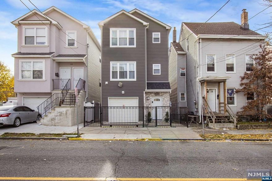 Not all investments are created equal, and this multifamily home in Paterson stands out as an exceptional opportunity for investors seeking unlimited income potential. This fully renovated property has been transformed into an investor's dream, offering multiple units that can generate significant rental income. With a strategic approach, this home has been designed to maximize the return on investment. Each unit in this multi family home boasts three spacious bedrooms, providing ample living space for tenants. The stylish design and abundance of natural light make these units highly desirable to potential renters. The kitchens have been thoughtfully designed with top-of-the-line appliances, ample storage space, and sleek countertops. The bedrooms are comfortable and spacious, providing tenants with a relaxing retreat. Additionally, the lower level features a fully equipped one-bedroom living space, which provides additional value add to the income potential.