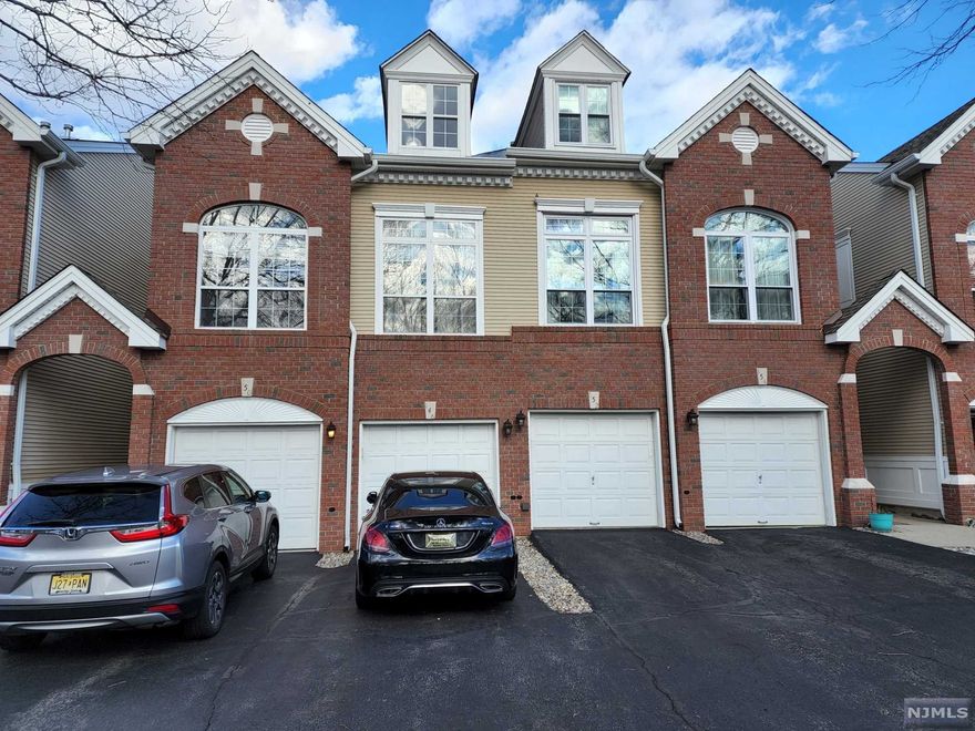 Immaculate three level Townhouse with an open floor plan. The first level features, updated kitchen, dining room, large living room with a gas fireplace and sliding doors to the balcony, 1/2 bathroom, laundry room/mud room to garage entrance. The second floor features master bedroom with master bath with stall shower & soaking jetted bathtub, second bedroom, main bath and a large storage closet in the hallway. The ground level features a family room with sound proof walls, built-in speakers with sliding glass doors to the patio, a bonus room that can be used as a recreation room or office, utility room with a workshop area & storage. Hardwood floors throughout the first floor and new wall to wall carpeting on the second floor.