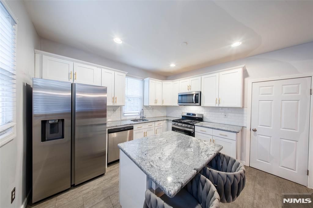 Photo of 8 Tremont Avenue, East Orange, NJ 07018 (MLS # 25042044)