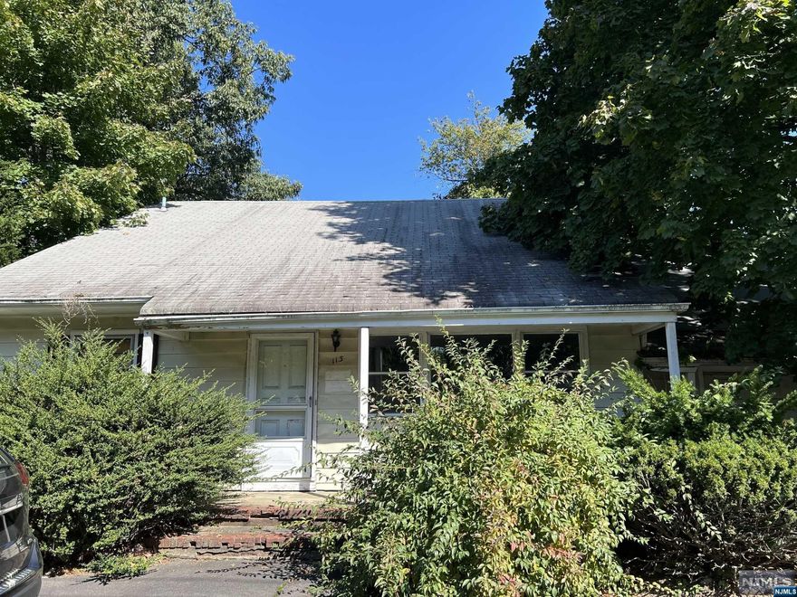 Looking at the property this is the white house on the right. It is a cape style house with 4 bedrooms plus a bonus room over the garage. There are two full bathrooms. The house has over 2,000 square feet of space. The house was built in the 1960s. In conjunction with the property next to it at 117 W. Midland Avenue the properties contain over 9 acres of land and fronts on Midland Avenue but extends in an upside down 'L' shape to the rear of a commercial property on Route 17 located at the old Staples store. # 117 sold separately but would package the properties together, if interested - MLS # 22042696.