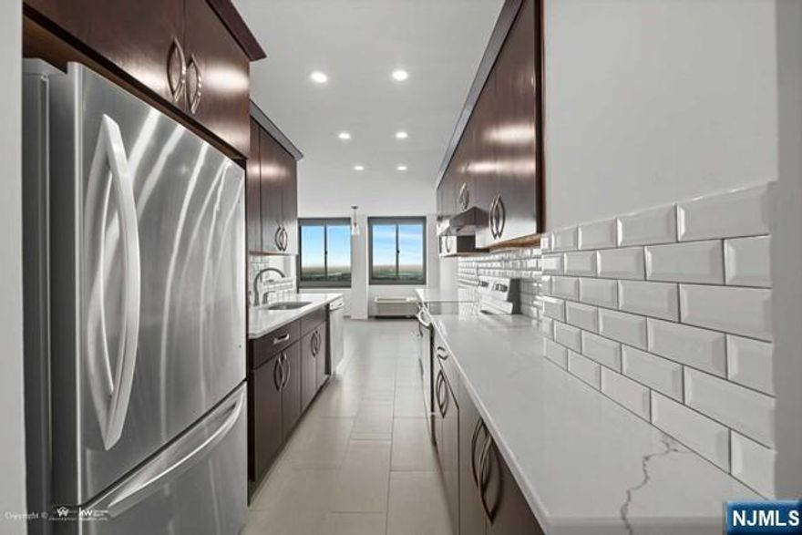 *Presented by Wendy Gamez 917-504-3347 * Totally renovated condo residence at the sought-after Winston Towers 200, offering 1,533 sqft. of impeccably remodeled living space. This top-floor 2-bedroom, 2-full-bath condo showcases a sun-drenched open living and dining layout with sweeping sunset views from every room, complemented by a private 111 sqft. balcony overlooking breathtaking western sunsets. The designer kitchen features quartz countertops, stainless steel appliances, and a spacious walk-in pantry, seamlessly blending style and functionality. The expansive primary suite serves as a private retreat, highlighted by an enlarged spa-like en-suite bath and a generous walk-in closet. As part of the complete renovation, youâ€™ll find ALL-NEW WINDOWS, recessed lighting, all-new AC units, custom blinds, and numerous additional upgrades throughout. The HOA of $1,035.89 includes storage, water, hot water, use of all amenities, common areas, and 24-hour doorman service. Residents enjoy resort-style amenities including an outdoor pool, tennis and basketball courts, and a playground, all within a full-service, impeccably maintained community. Ideally located with effortless NYC access via bus service and a complimentary ferry shuttle at your doorstep, this residence offers refined living with unparalleled convenience. Parking is available at an additional cost: indoor single space $100/month, outdoor $85/month, tandem (2 spaces) $150/month.