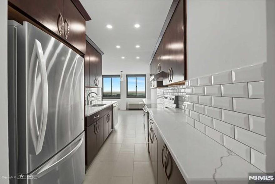 *Presented by Wendy Gamez 917-504-3347* Totally renovated condo residence at the sought-after Winston Towers 200, offering 1,533 sqft. of impeccably remodeled living space. This top-floor 2-bedroom, 2-full-bath condo showcases a sun-drenched open living and dining layout with sweeping sunset views from every room, complemented by a private 111 sqft. balcony overlooking breathtaking western sunsets. The designer kitchen features quartz countertops, stainless steel appliances, and a spacious walk-in pantry, seamlessly blending style and functionality. The expansive primary suite serves as a private retreat, highlighted by an enlarged spa-like en-suite bath and a generous walk-in closet. As part of the complete renovation, youâ€™ll find ALL-NEW WINDOWS, recessed lighting, all-new AC units, custom blinds, and numerous additional upgrades throughout. The HOA of $1,035.89 includes storage, water, hot water, use of all amenities, common areas, and 24-hour doorman service. Residents enjoy resort-style amenities including an outdoor pool, tennis and basketball courts, and a playground, all within a full-service, impeccably maintained community. Ideally located with effortless NYC access via bus service and a complimentary ferry shuttle at your doorstep, this residence offers refined living with unparalleled convenience. Parking is available at an additional cost: indoor single space $100/month, outdoor $85/month, tandem (2 spaces) $150/month.