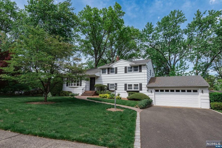 Spacious Split Level offers oversized Living Room open to Dining Room, MEIK, 2nd Floor has Primary bedroom w/ half bath, 2 additional bedrooms. Ground Floor offers extra large family room w/ fireplace, laundry & access to 2 car garage. Full unfinished basement ready to be finished. Central vac, HW floors as installed, SS appliances, CAC, heated driveway. Enjoy everything that Glen Rock has to offers! Award winning schools!